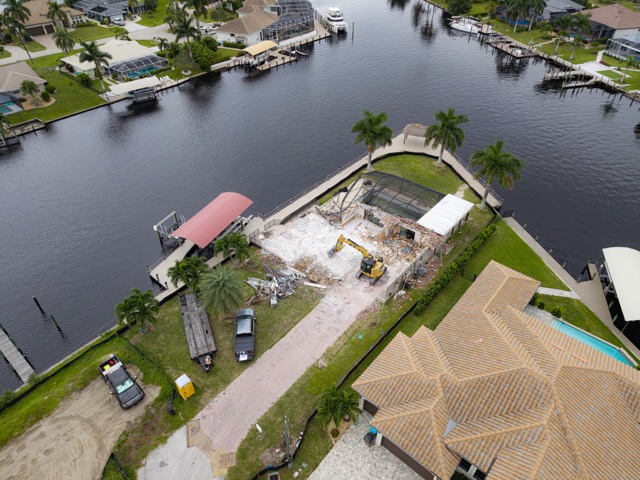Large aerial composition of a demolition site and surrounding area